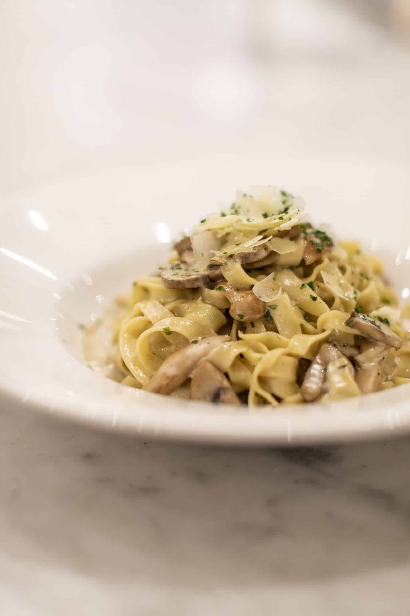 Photo of wide ribbon tagliatelle pasta with mushrooms