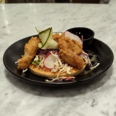 Fried Chicken pancake with coleslaw and siracha maple syrup. Available for pancake day 2023