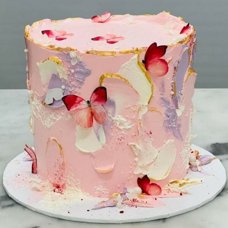Custom decorated cake available at Brunetti Classico Carlton. Pink textured buttercream and butterfly motifs. Little girls birthday party cake, gender reveal cake, baby shower cake, pink cake, 1st birthday cake