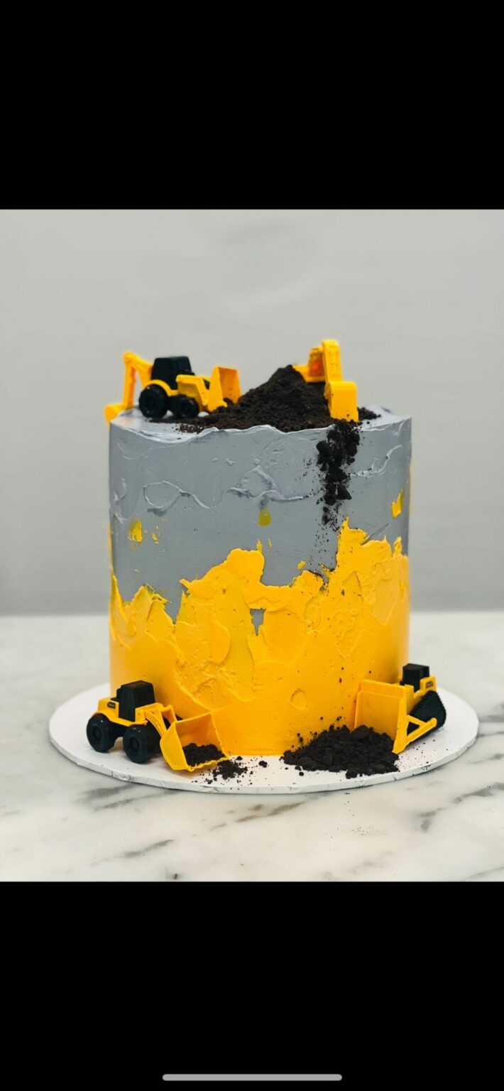 Custom decorated cake available at Brunetti Classico Carlton. Textured buttercream with tonka truck decoration. Little boys birthday party cake, 1st birthday party cake, truck cake