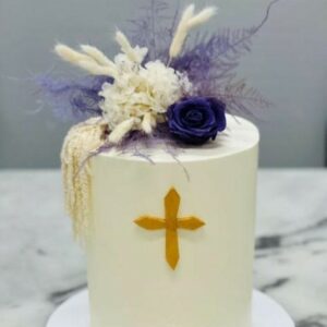 Custom decorated cake available at Brunetti Classico Carlton. Baptism cake with purple and white dried flowers. Pressed flower cake decoration trend 2023